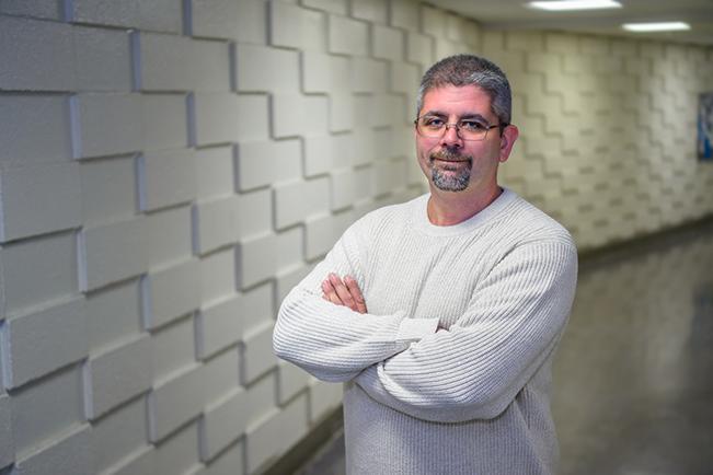 Len W. in hallway on campus