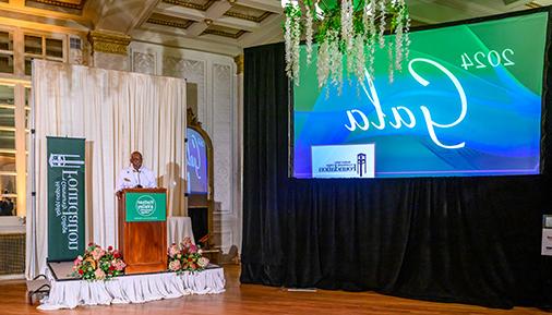 Louis Coplin at the podium during the 2024 gala